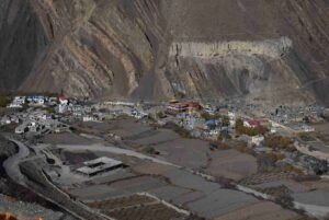 Aerial view of a traditional Himalayan village with monastery on the Annapurna Circuit