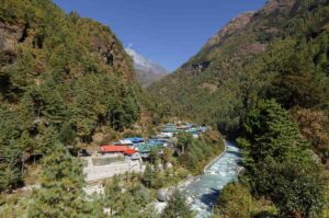 Khumbu valley village beside river on Everest trek