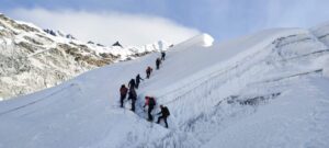 Climbers roped together on corniced ridge, Island Peak