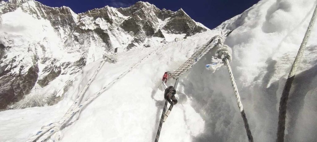 Fixed ropes anchored on Island Peak ice slope